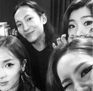 Alexander poses with the 2NE1 girls